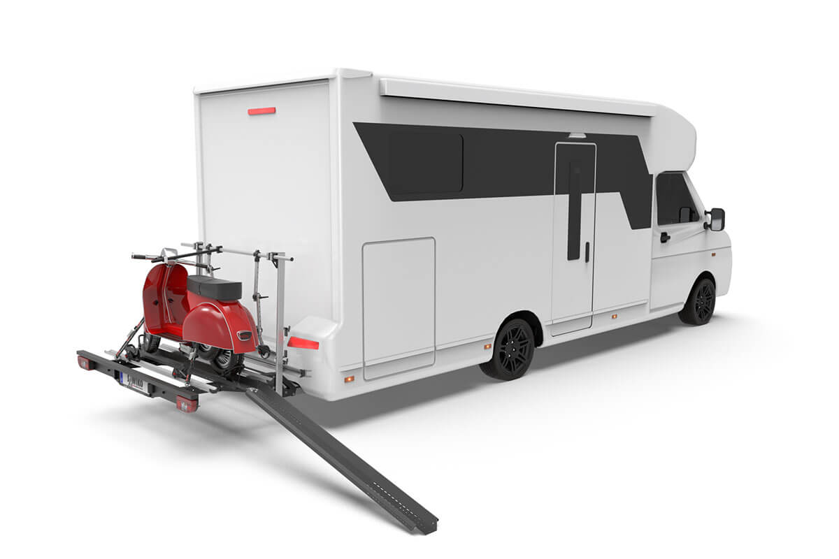 Camper van equipped with a Sawiko Vario motorcycle and bike carrier with a scooter loaded via the loading ramp