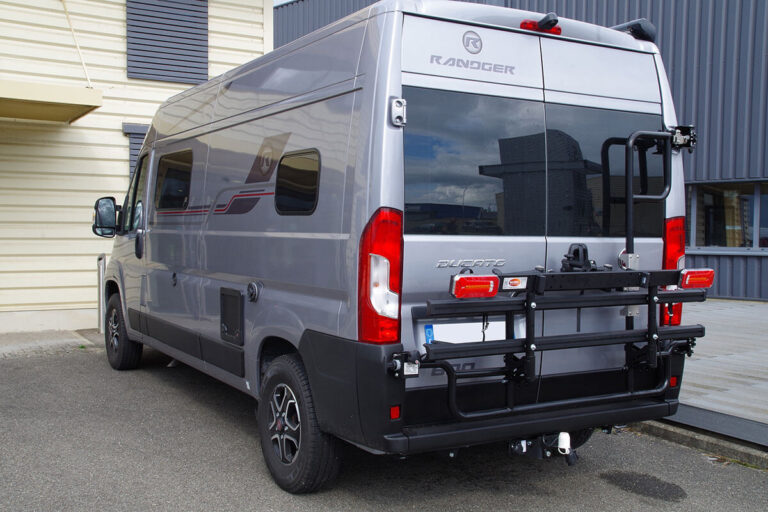Tilting bike rack VAN-BIKE 2 with rear door hinge mounting for a Fiat Ducato van